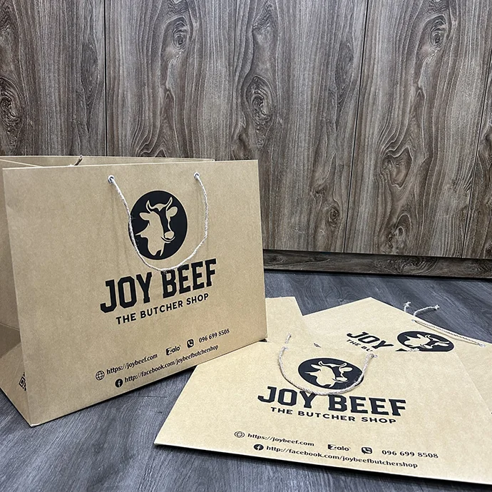 Túi giấy kraft tay xách dây dù in logo Joy Beef The Butcher Shop